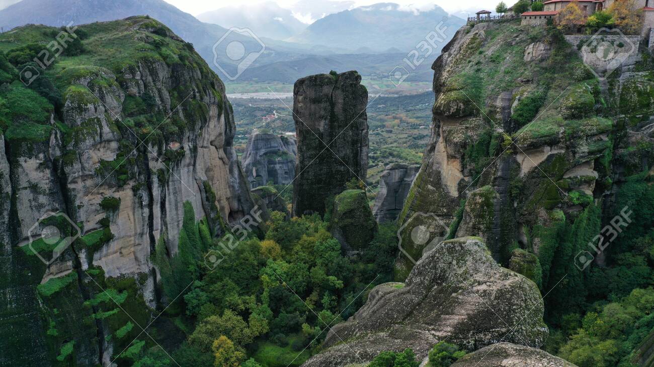 Aerial view of Meteora natural mountains, Kalambaka, Greece. Kalabaka National park with orthodox monasteries. Cliff valley. - 140592742 Aerial view of Meteora natural mountains, Kalambaka, Greece. Kalabaka National park with orthodox monasteries. Cliff valley. - 140592742