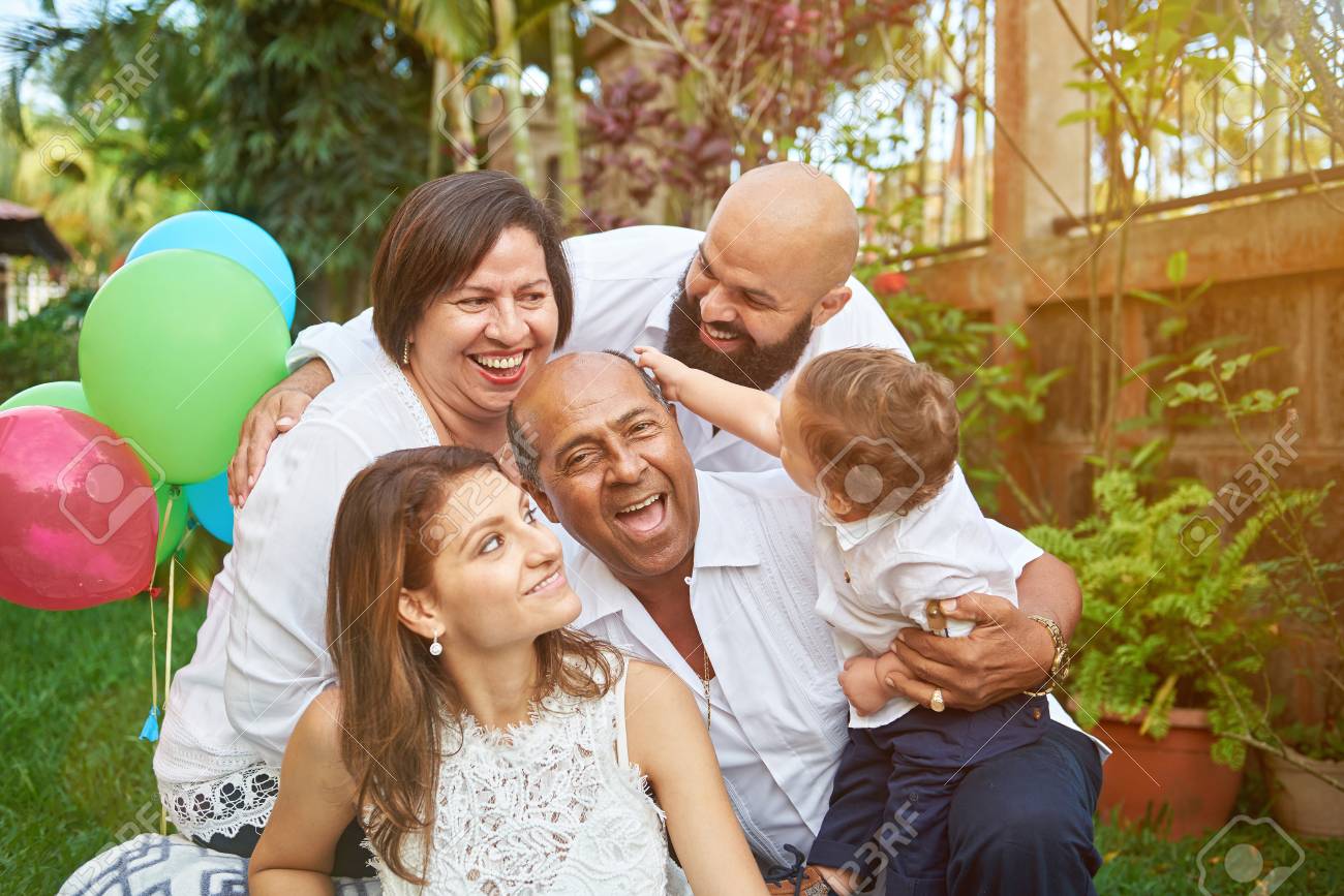 Latino family have fun on garden with small son kid boy - 128188532 Latino family have fun on garden with small son kid boy - 128188532