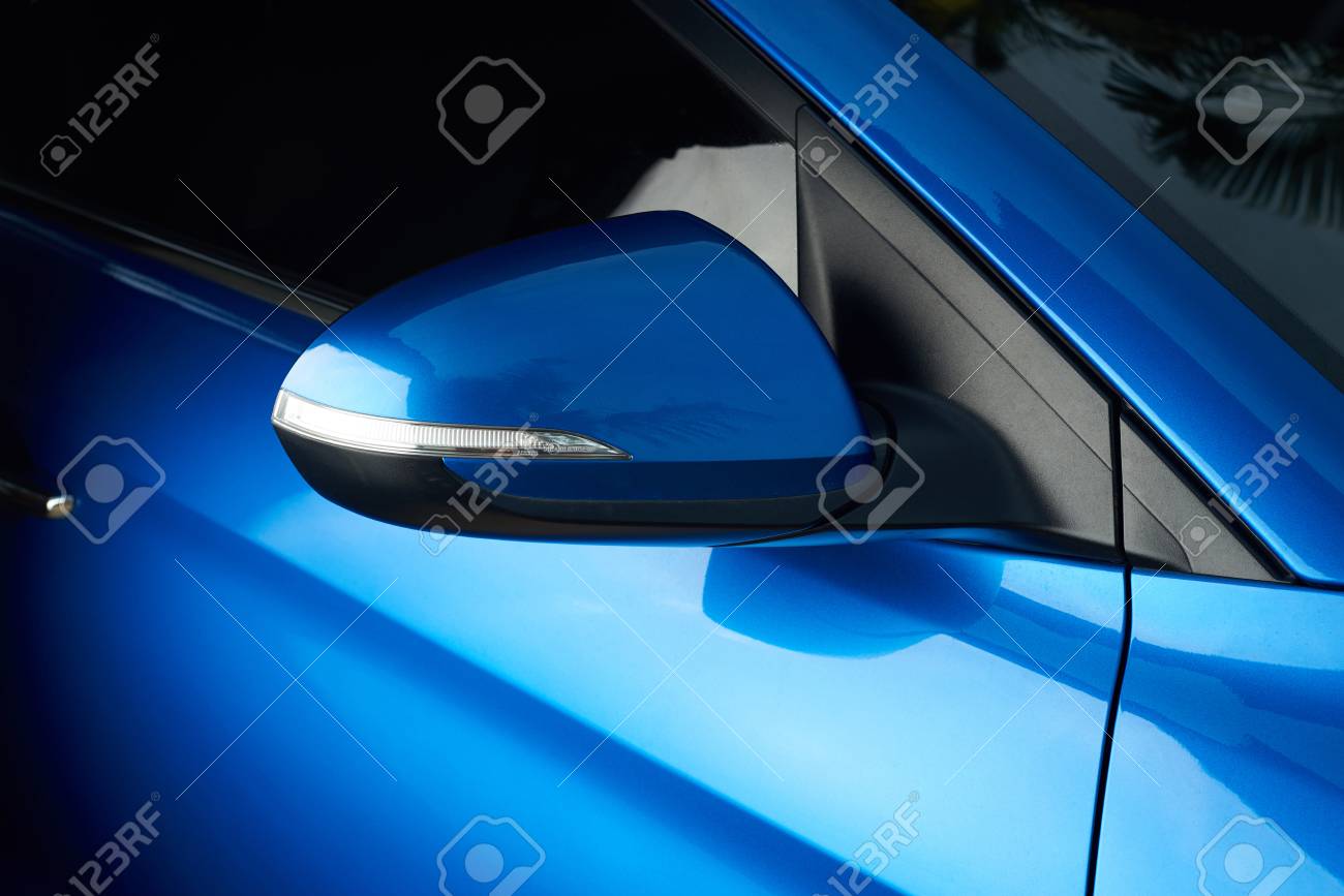 Side car mirror close-up. Details of blue car - 81603644 Side car mirror close-up. Details of blue car - 81603644