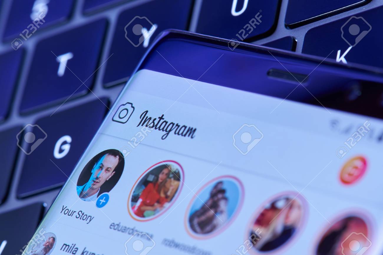 New york, USA - July 6, 2018: Instagram stories menu on smartphone screen lay on laptop keyboard - 121444062 New york, USA - July 6, 2018: Instagram stories menu on smartphone screen lay on laptop keyboard - 121444062