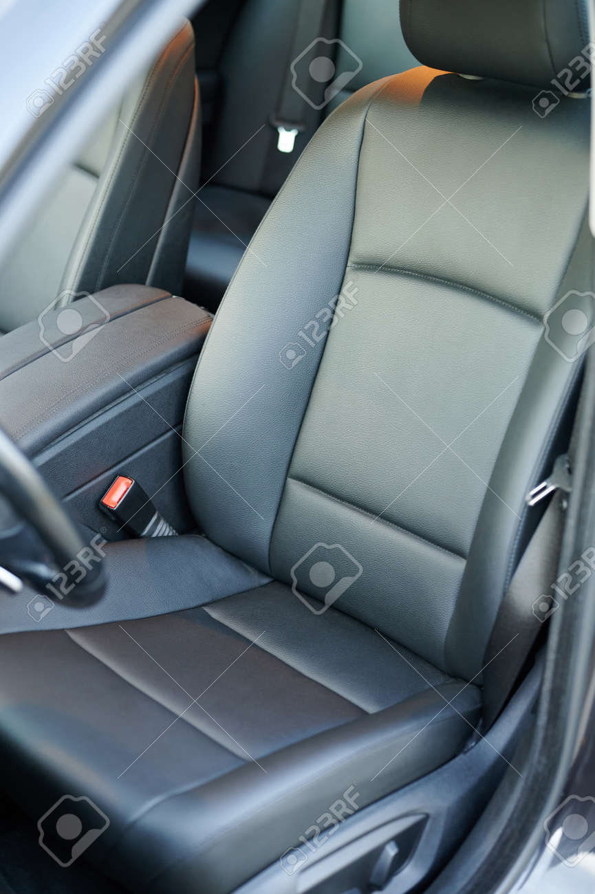 Clean dark black leather driver car seat with handrest - 171863521 Clean dark black leather driver car seat with handrest - 171863521