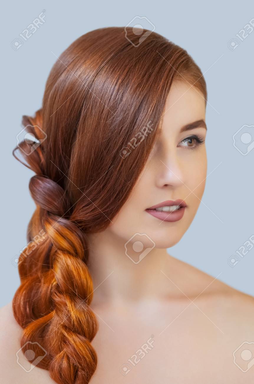 Beautiful Girl With Long Red Hair Braided With A French Braid