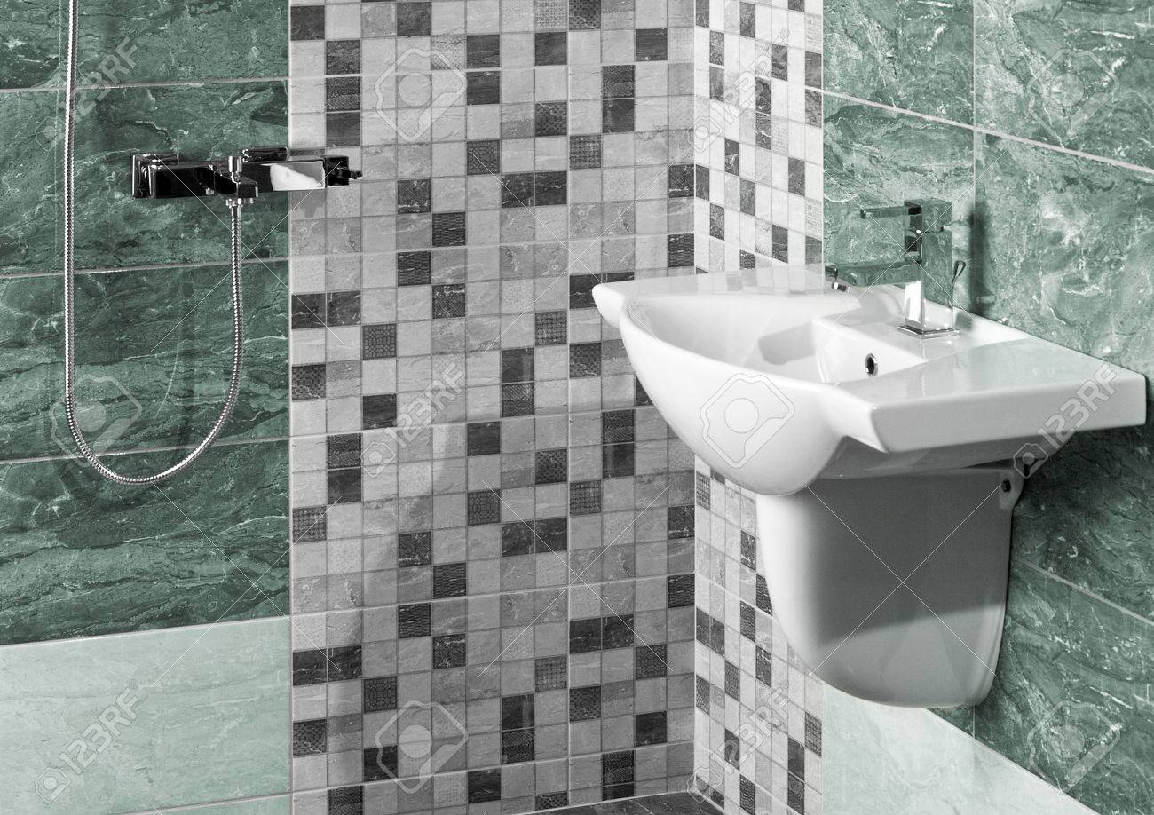 detail of a modern bathroom interior with white sink and marble tiles - 42118595 detail of a modern bathroom interior with white sink and marble tiles - 42118595