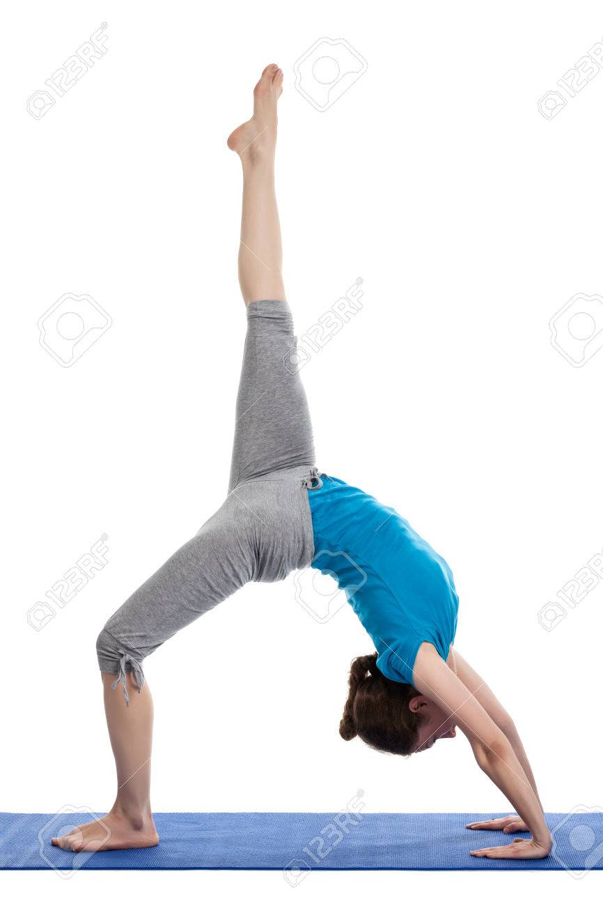 Yoga - young beautiful woman yoga instructor doing Wheel Pose.. Yoga - young beautiful woman yoga instructor doing Wheel Pose..