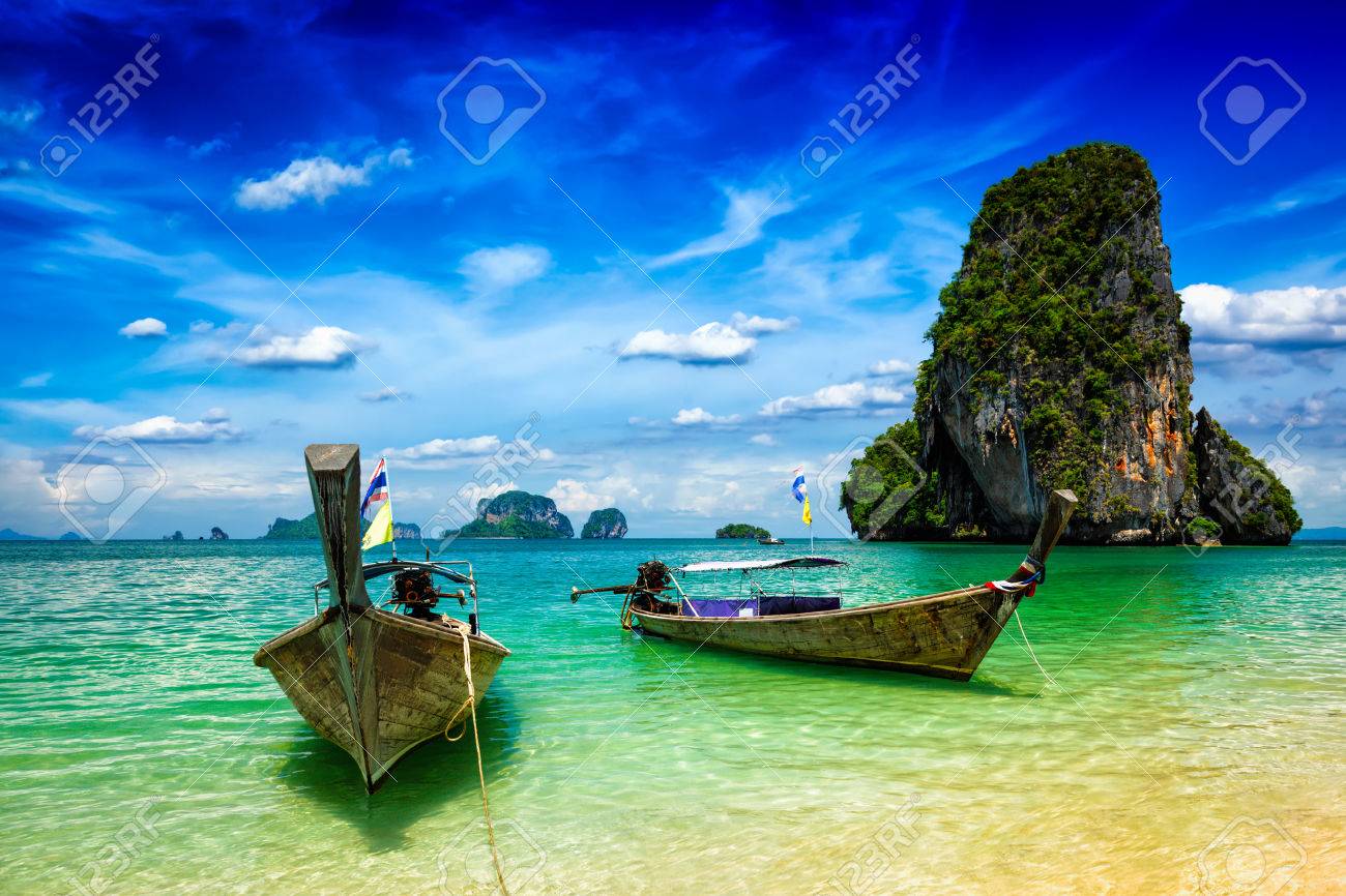 Long tail boats on tropical beach (Pranang beach), Krabi, Thailand - 43578815 Long tail boats on tropical beach (Pranang beach), Krabi, Thailand - 43578815
