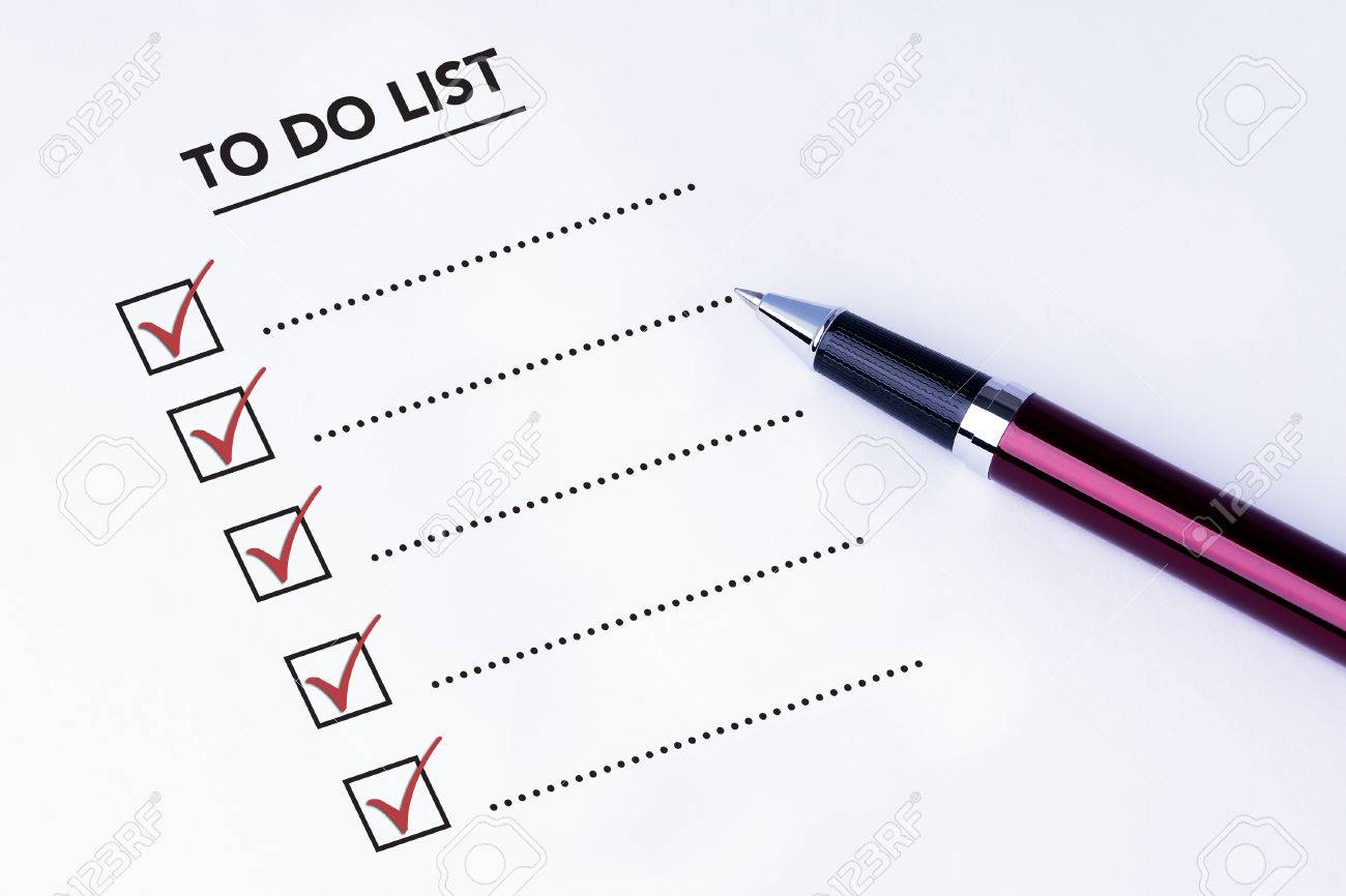 tick placed in all check box on to do list form with a pen on