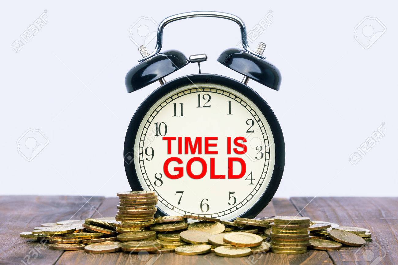 Written Word Time Is Gold On A Clock With Gold Coins On Top Of A Wooden Table Financial Wealth Concept Stock Photo Picture And Royalty Free Image Image 53125317