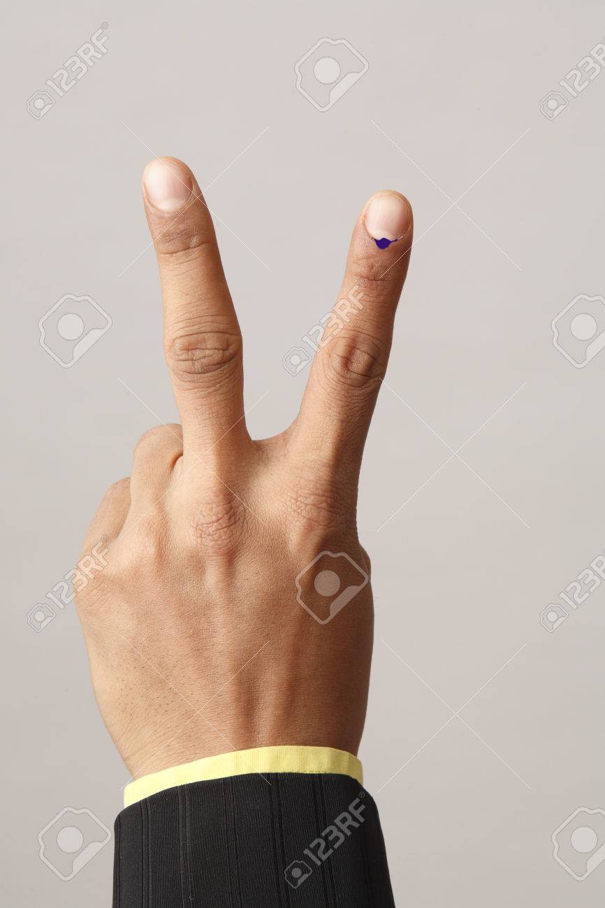 Executive Showing Voting Mark On Index And Middle Finger Stock Photo,  Picture And Royalty Free Image. Image 85790746.