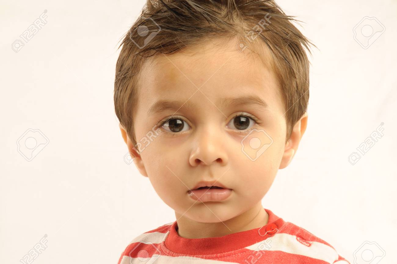 Boy looking anxiously with broad eyes - 85910207 Boy looking anxiously with broad eyes - 85910207