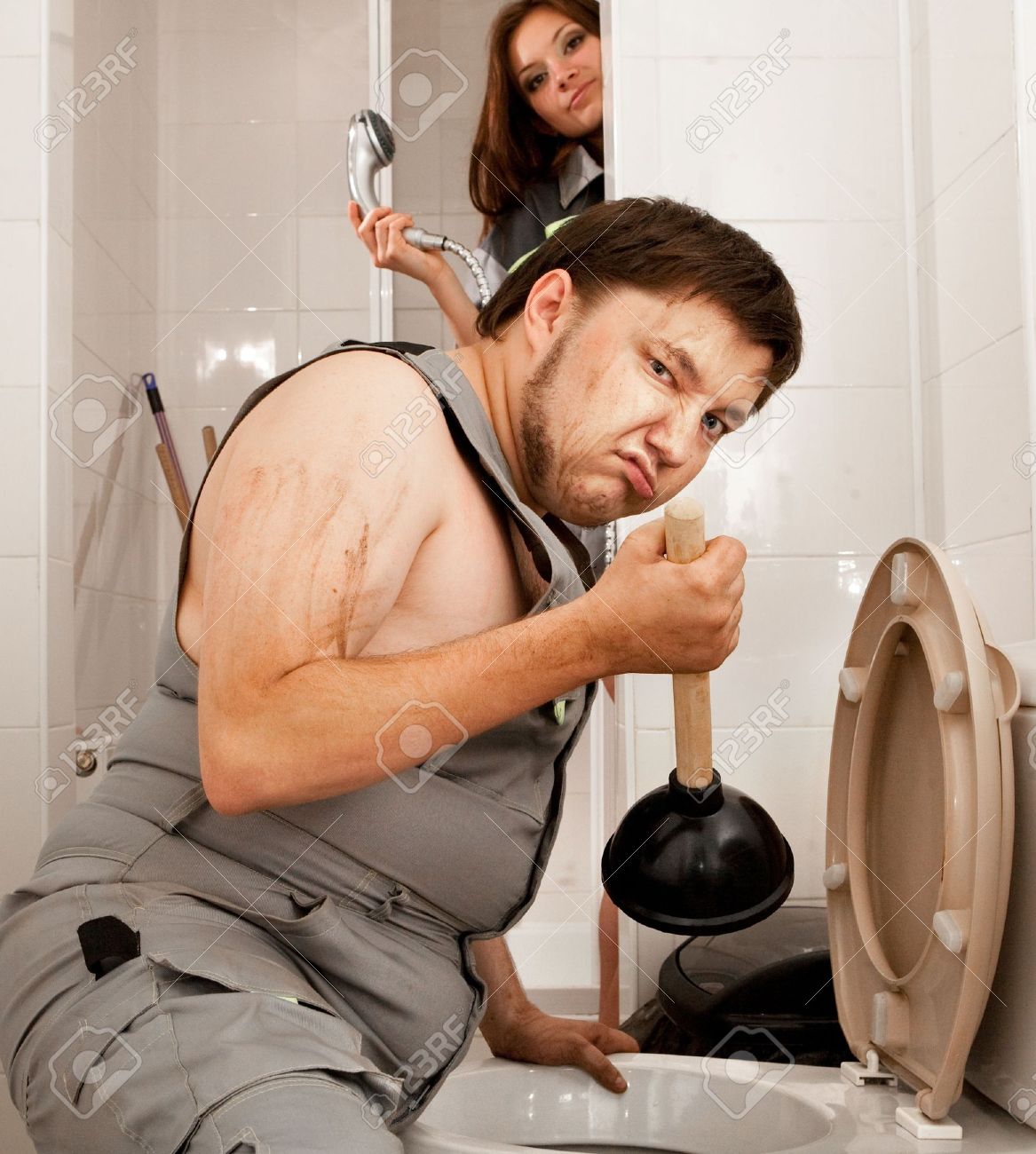 5057482-angry-plumber-with-the-plunger-in-the-bathroom-girl-with-the-shower-on-the-background-.jpg