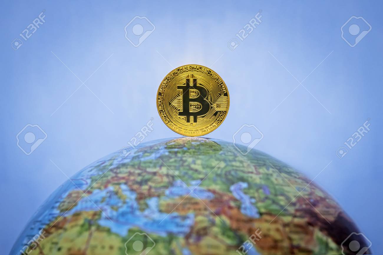Bitcoin Gold Coin. Virtual Cryptocurrency Concept. Bitcoin As A Symbol World  Currency. The Cryptocurrency Bitcoin On The Globe. Globalization,  Globalize, Worldwide, Universal, Global, International, Stock Photo,  Picture and Royalty Free Image. Image
