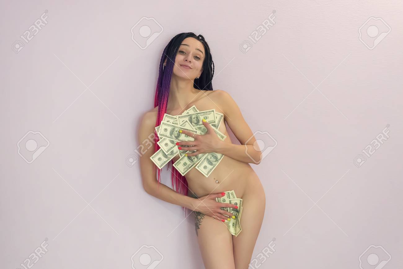 Naked Young Girl Covers Her Naked Body With Money. The Concept Of Selling  Love. The Stripper Keeps His Tip. Sexy Woman Gets Pleasure From Money. A  Girl With A Non-standard Appearance. Фотография,