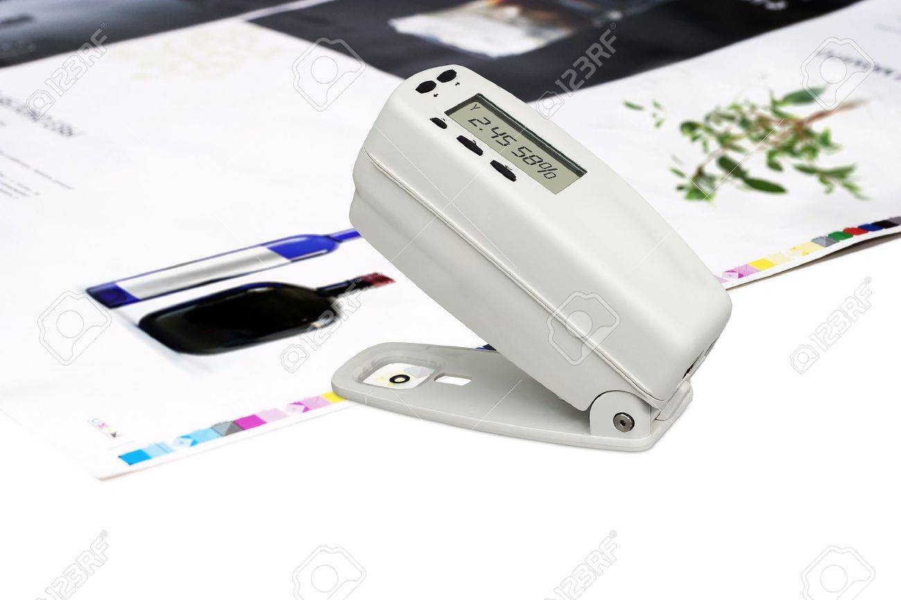 Measuring color density with densitometer on offset printed sheet - 10401067 Measuring color density with densitometer on offset printed sheet - 10401067