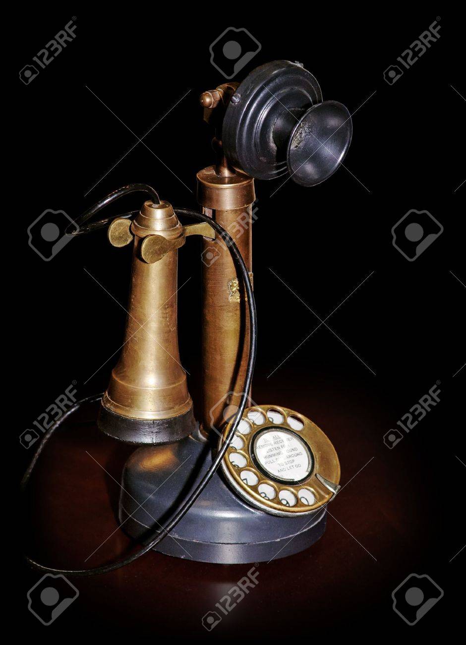Vintage phone on table isolated on black (pure black edges on picture) with clipping path - 10160346 Vintage phone on table isolated on black (pure black edges on picture) with clipping path - 10160346