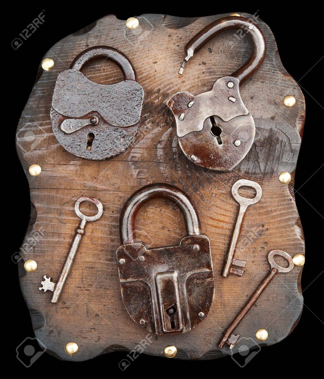 old locks and keys on wooden plank isolated stock photo picture and