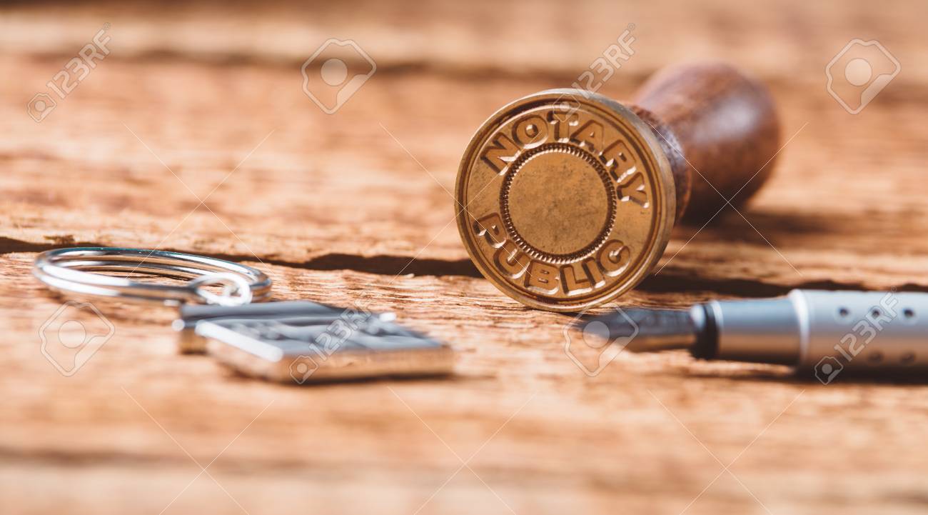 Notary public wax stamper on old wooden background - 67960754 Notary public wax stamper on old wooden background - 67960754