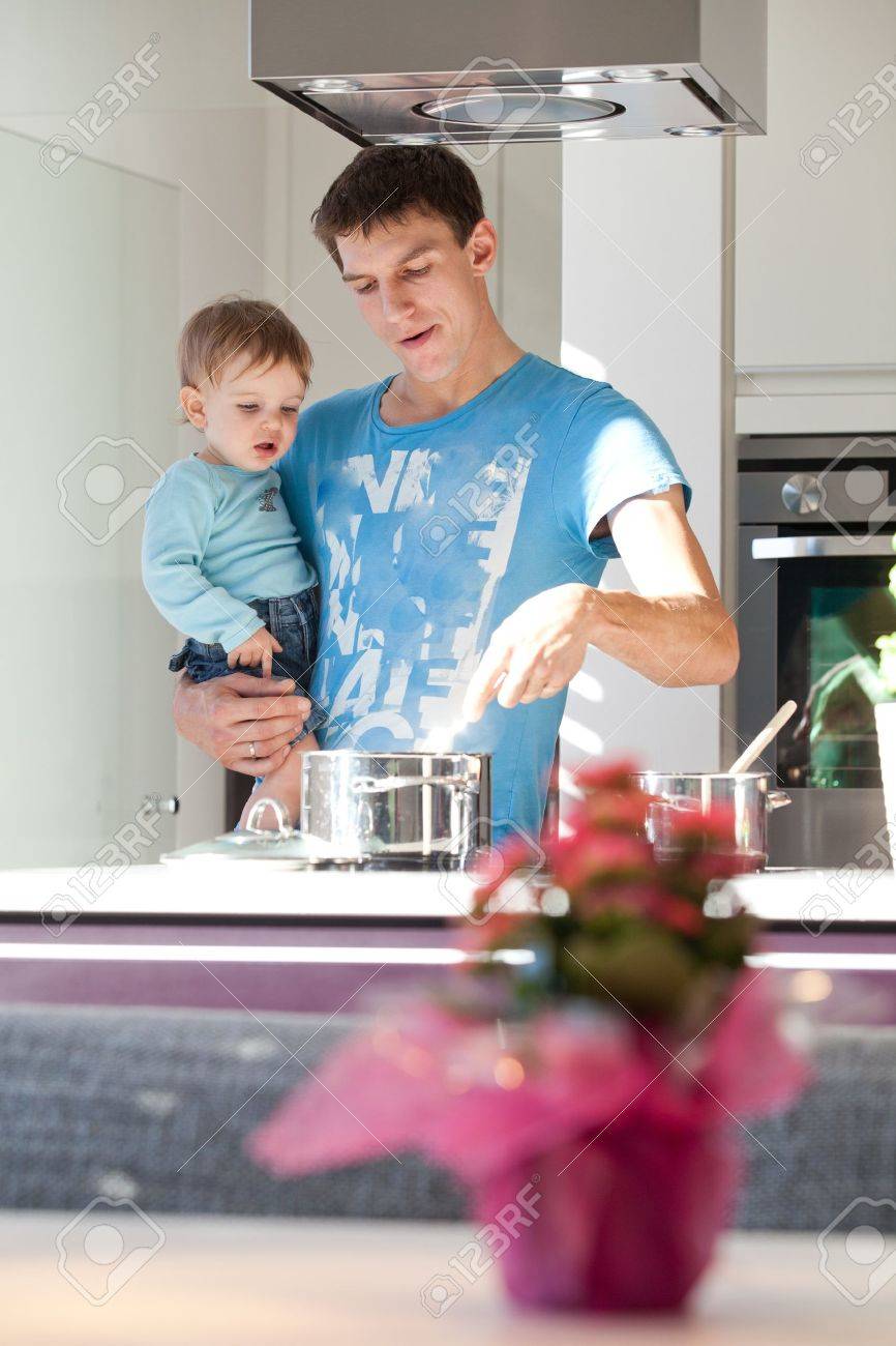 Young Father Cooking With His Baby Son In A Modern Kitchen Stock Photo Picture And Royalty Free Image Image 11754079