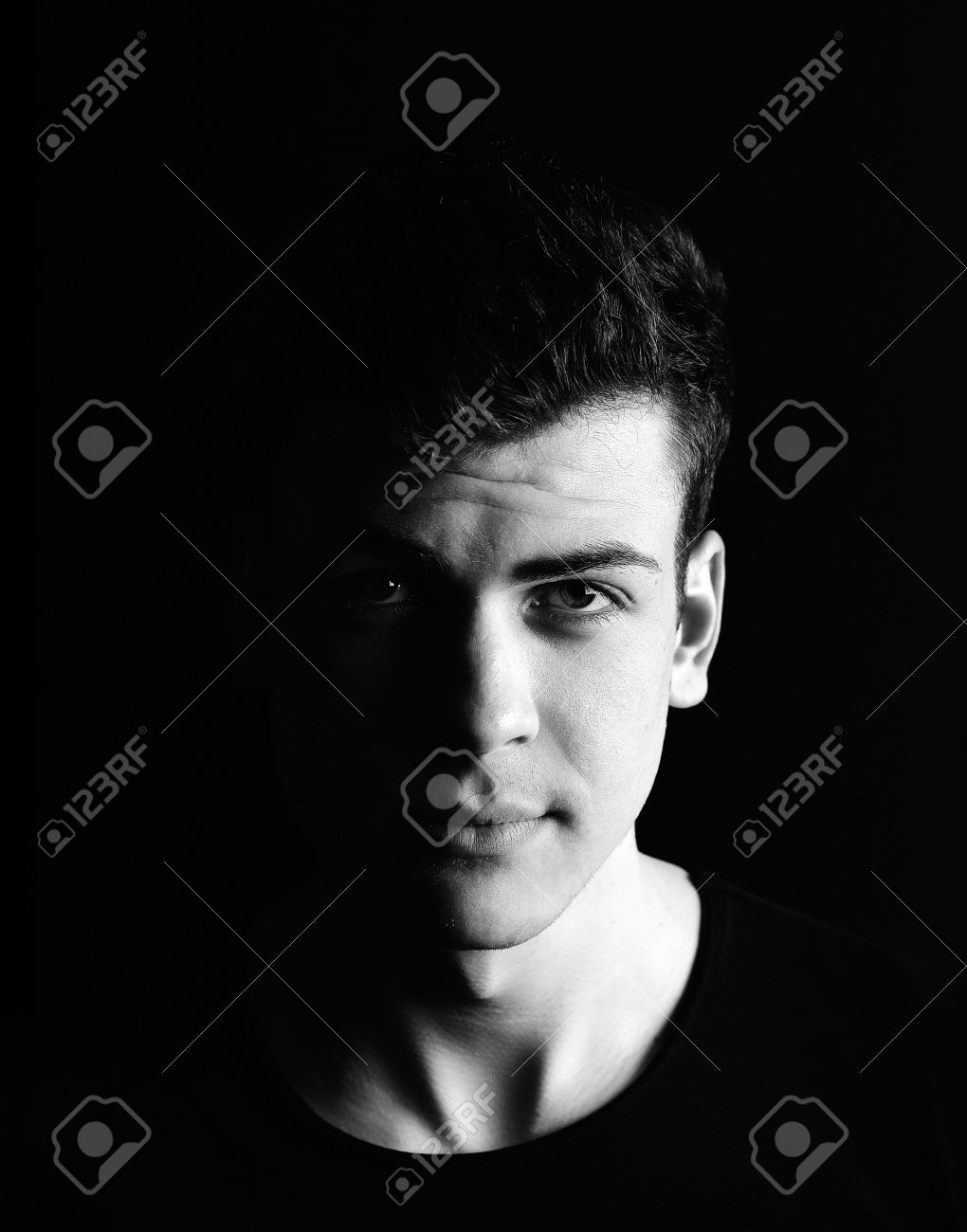 Half Face Young Man Portrait In Low Key Stock Photo Picture And