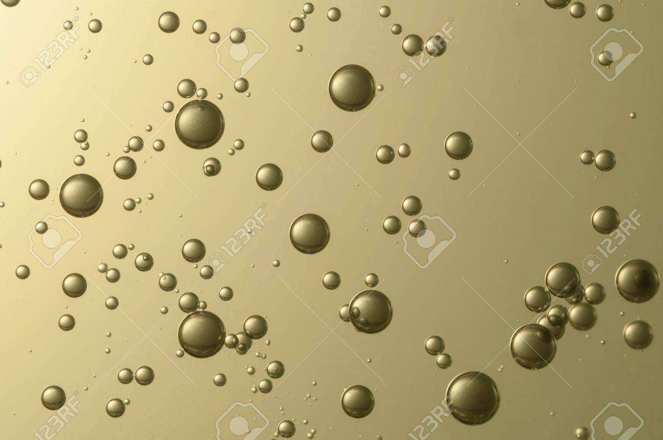 golden air bubbles float over a blurred background bubbles float