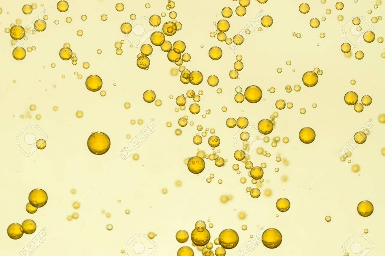 golden fizz bubbles float over a light background bubbles float