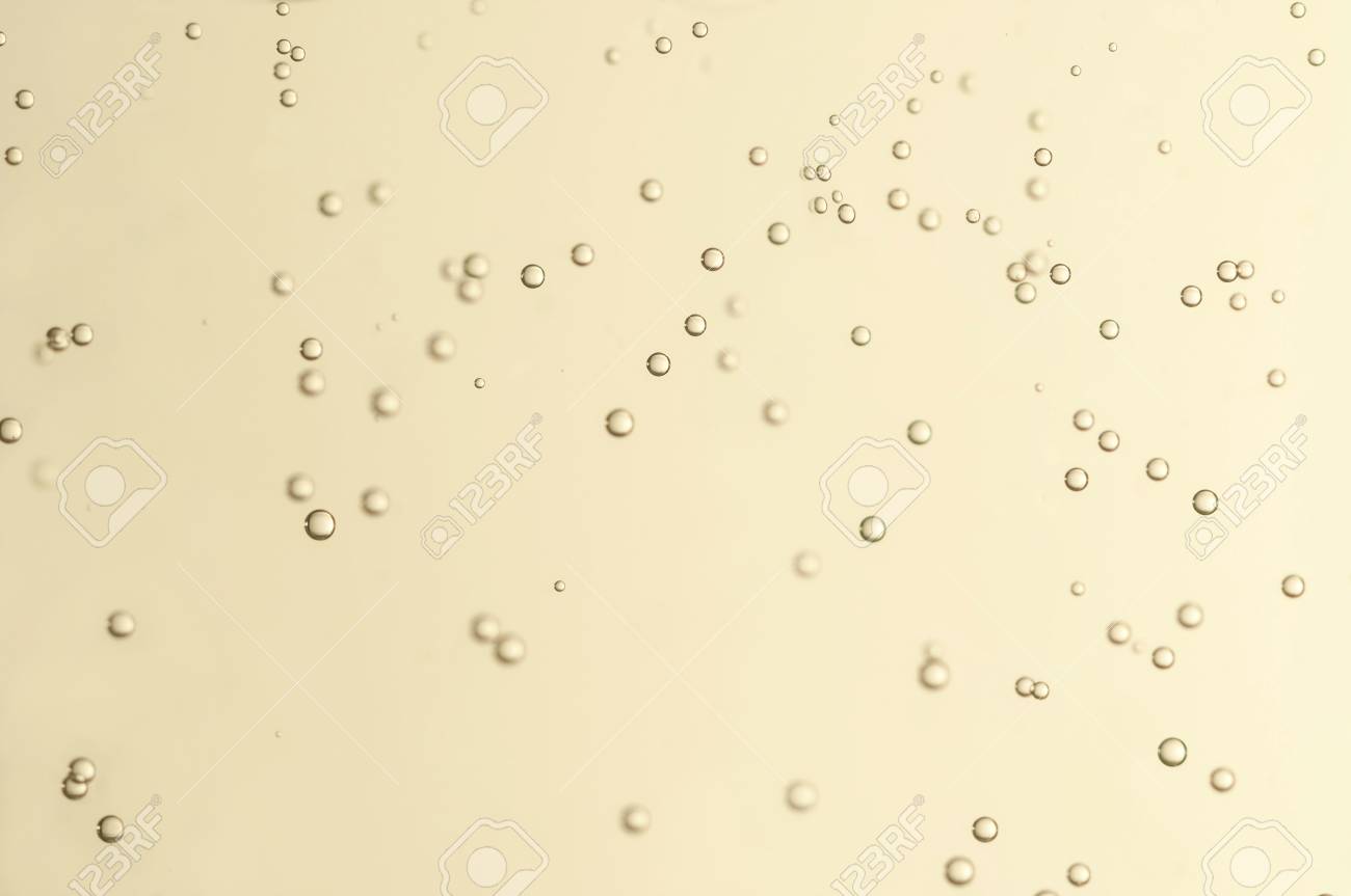 champagne bubbles float over a blurred background bubbles float