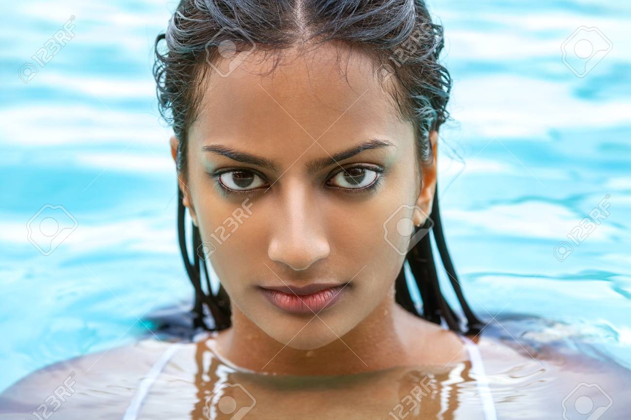 Sexy Indian girl in bikini emerging from pool