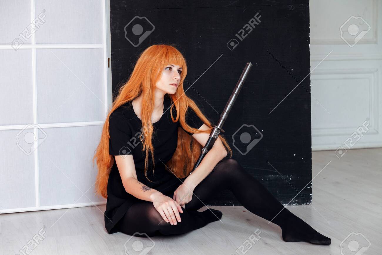 Young Woman In Japanese Anime Cosplay Holding Samurai Sword Stock Photo Picture And Royalty Free Image Image