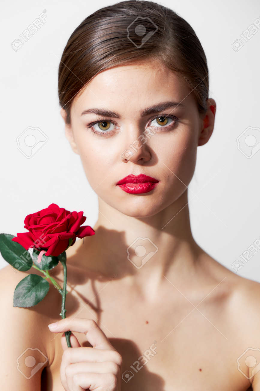 Woman with flower Bare shoulders are an attractive luxury look red lips - 155704702 Woman with flower Bare shoulders are an attractive luxury look red lips - 155704702