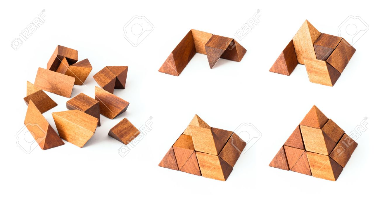 wooden pyramid puzzle from start to end building stock photo