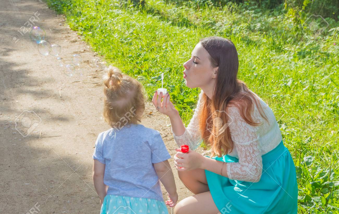 Walking, Baby And Mommy Blow Bubbles. Stock Photo, Picture and Royalty Free  Image. Image 85348469.