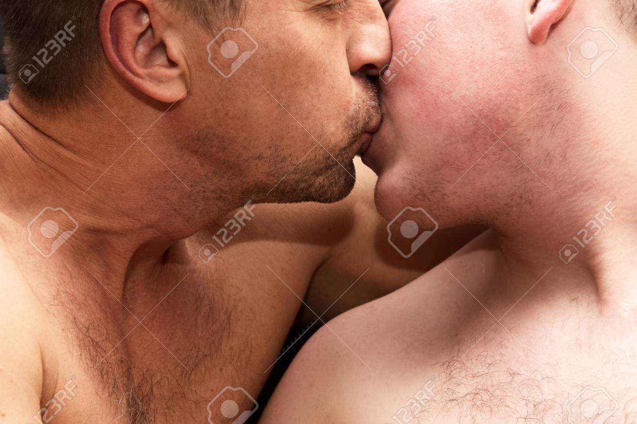 Naked men kiss