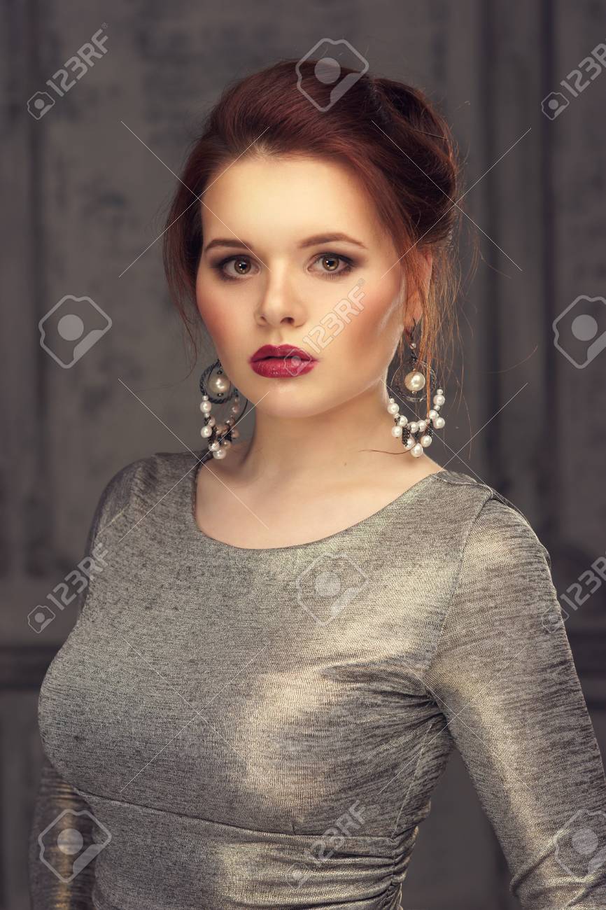 dmitry tsvetkovBeautiful Red Head Woman In Gray Dress