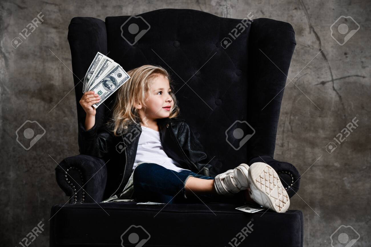 Rich Kid Girl Millionaire In Leather Jacket Is Sitting In Plush Stock Photo Picture And Royalty Free Image Image 138780531