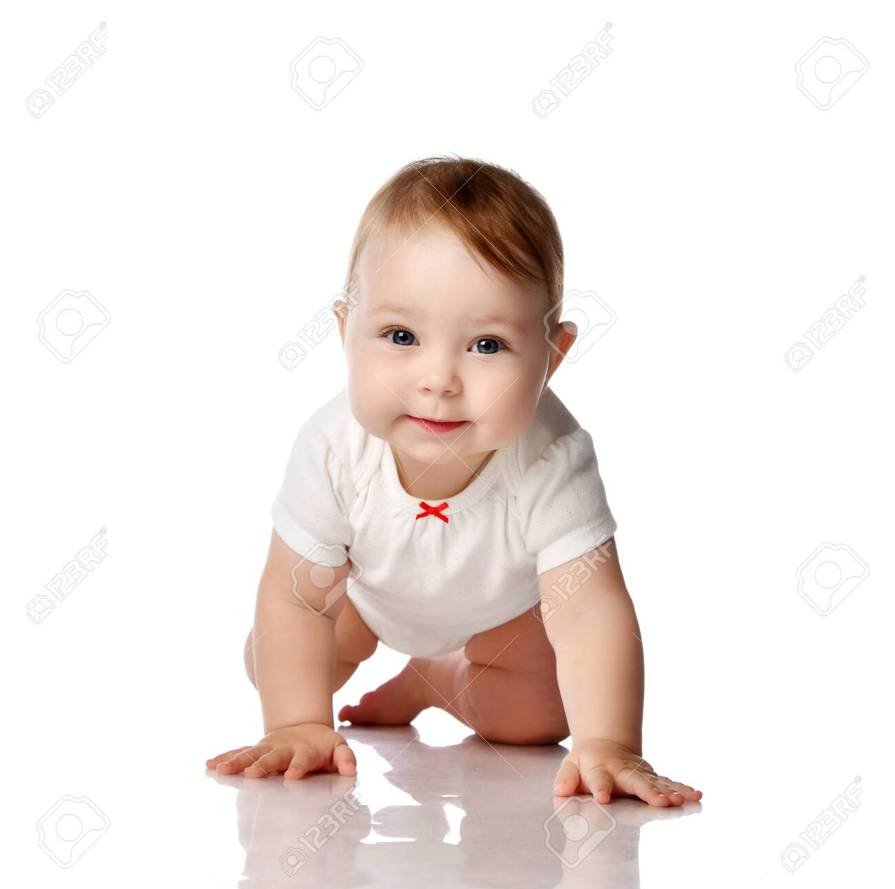 Adorable smiling curious little baby infant in white cotton bodysuit crawling creeping forward at camera over white background. Happy childhood concept - 151270571 Adorable smiling curious little baby infant in white cotton bodysuit crawling creeping forward at camera over white background. Happy childhood concept - 151270571