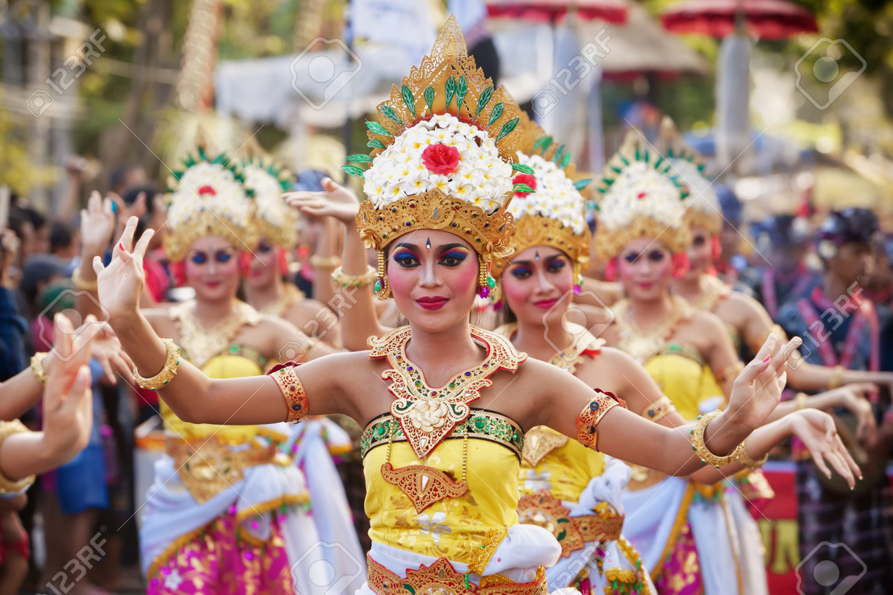 BALI, INDONESIA - JUNE 13, 2015: Beautiful women group dressed in colorful sarongs - Balinese style female dancer costume, dancing traditional temple dance Legong at Bali Art and Culture Festival show - 51412578 BALI, INDONESIA - JUNE 13, 2015: Beautiful women group dressed in colorful sarongs - Balinese style female dancer costume, dancing traditional temple dance Legong at Bali Art and Culture Festival show - 51412578