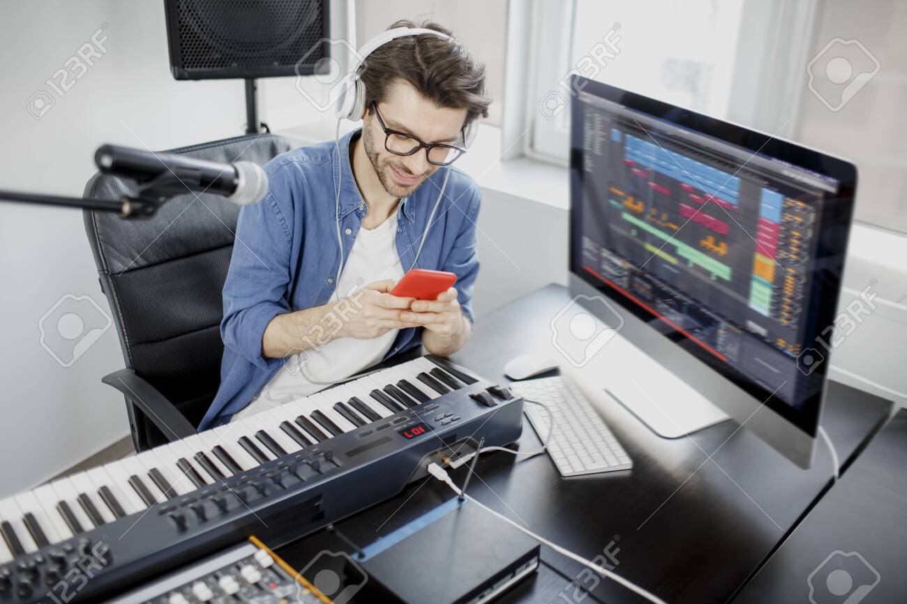 Man Holds A Smartphone In His Hands And Uses It Male Music Arranger Stock Photo Picture And Royalty Free Image Image 144493714