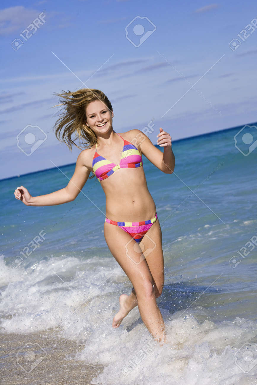teenage bikini Beautiful Caucasian Female Teenage Running Through To Surf Wearing A Colorful Bikini. Stock Photo, Picture and Royalty Free Image. Image 2547419.