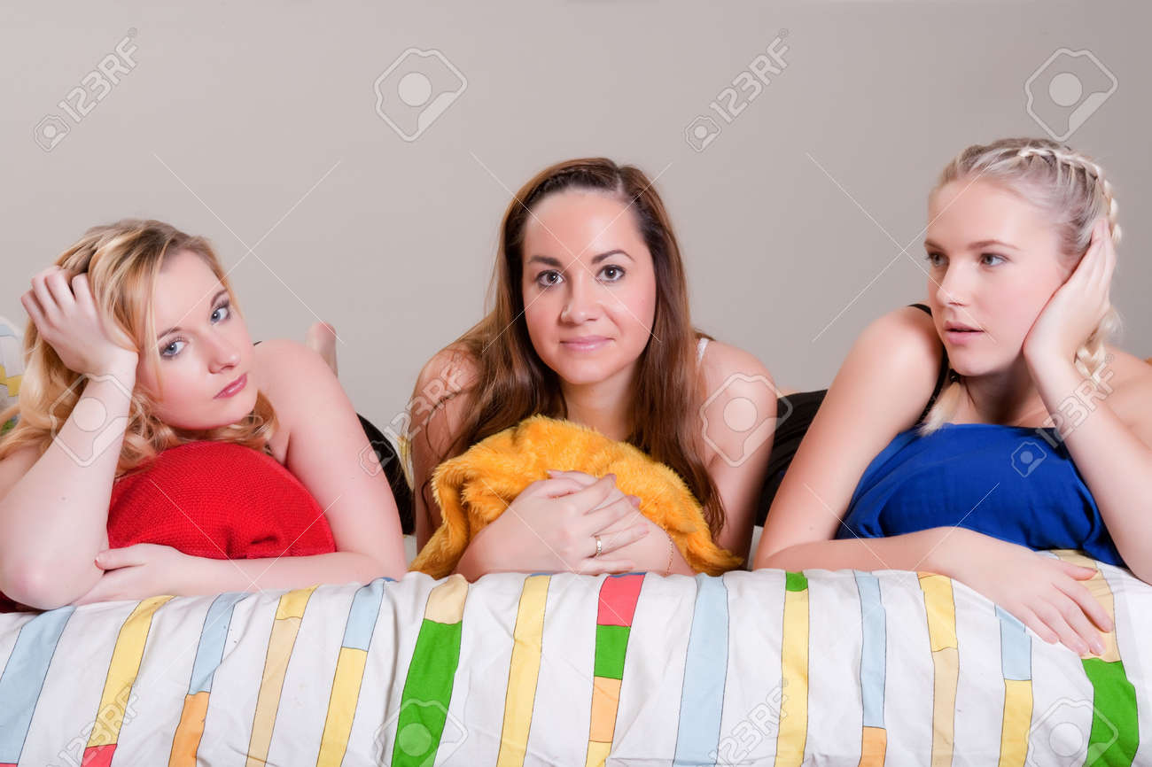 3 Friends Having A Pyjama Party In A Bedroom