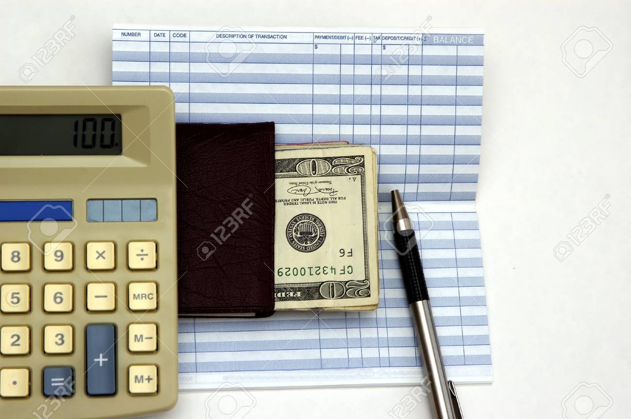 calculator check book transaction register and a pen against