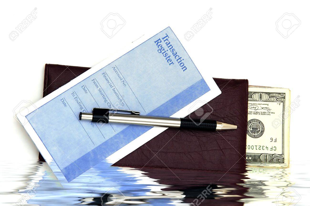 a check book transaction register and some money against a white
