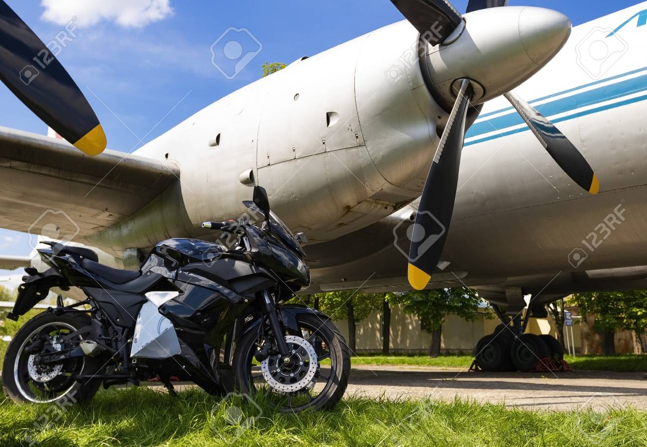 Ukraine, Kiev April -27 2018:Sport bike on the background of an old airplane.Kiev April-27 2018 - 107230327 Ukraine, Kiev April -27 2018:Sport bike on the background of an old airplane.Kiev April-27 2018 - 107230327