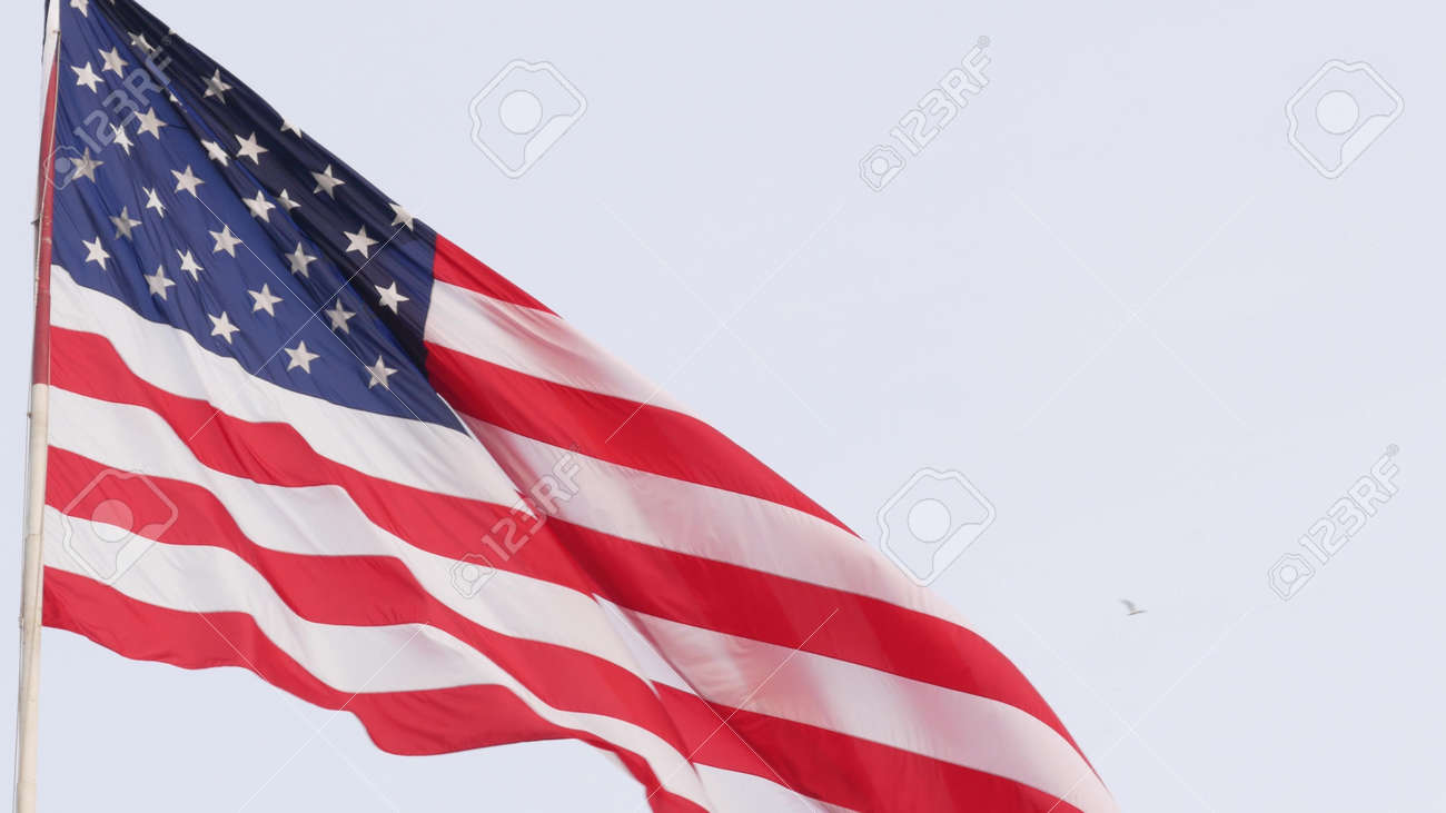 American Flag Waving In Wind, USA. National Symbol Waves In Breeze On  Flagpole. Real Old Glory Star Spangled Banner As Concept Of Independence,  Liberty, Democracy, Patriotism. Background For 4th July. Фотография,  картинки,