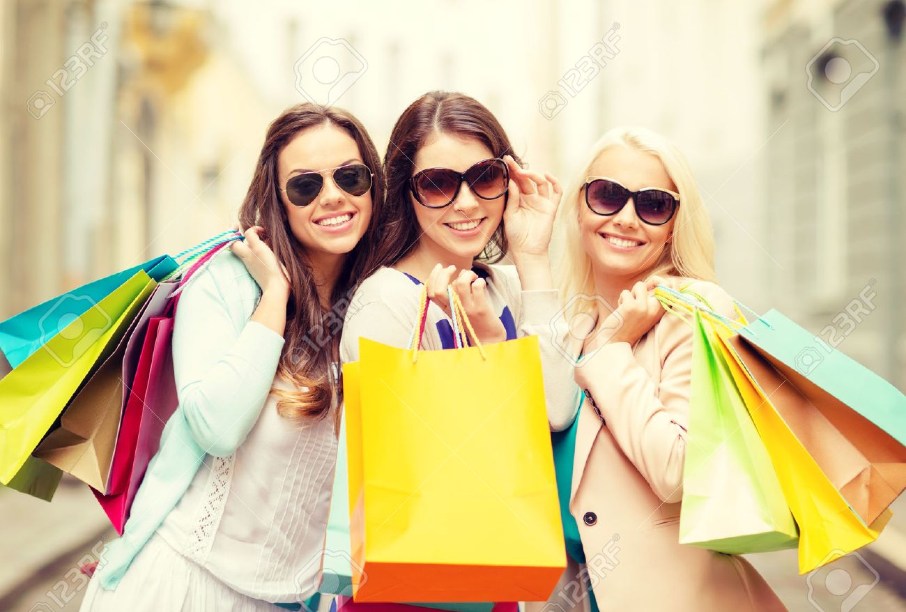 shopping, sale, happy people and tourism concept - three beautiful girls in sunglasses with shopping bags in ctiy - 28258749 shopping, sale, happy people and tourism concept - three beautiful girls in sunglasses with shopping bags in ctiy - 28258749