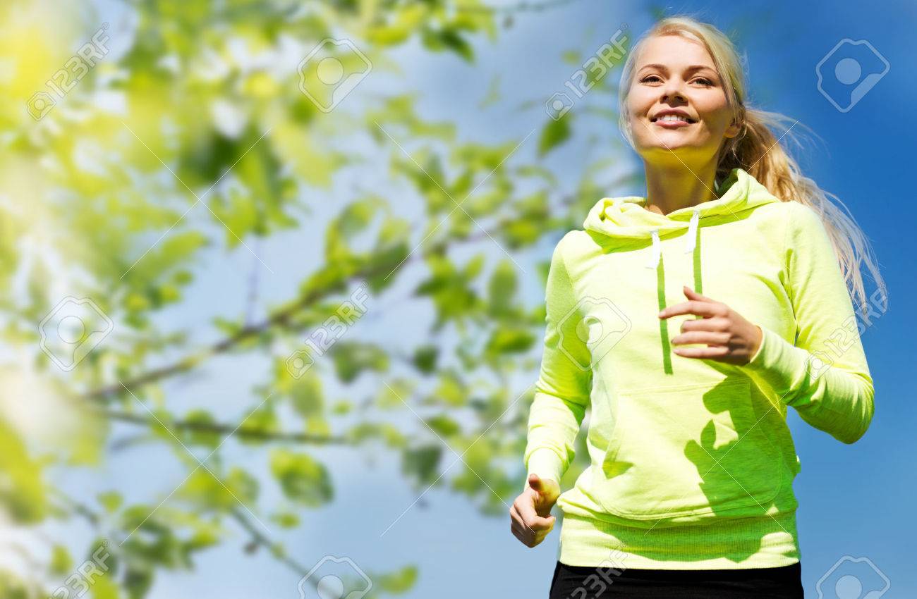 fitness, people and healthy lifestyle concept - happy young female runner jogging outdoors - 36669183 fitness, people and healthy lifestyle concept - happy young female runner jogging outdoors - 36669183
