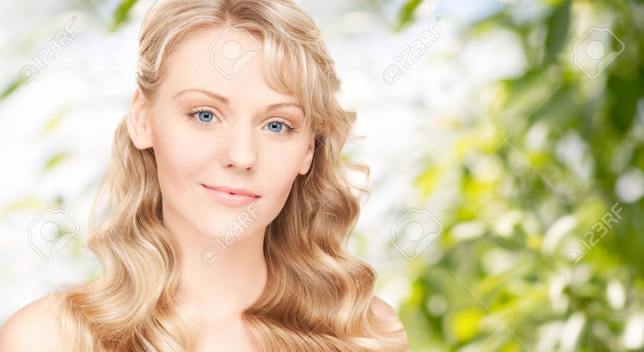 beauty, people, hair care and health concept - beautiful young woman face with long wavy hair over green background - 38879971 beauty, people, hair care and health concept - beautiful young woman face with long wavy hair over green background - 38879971