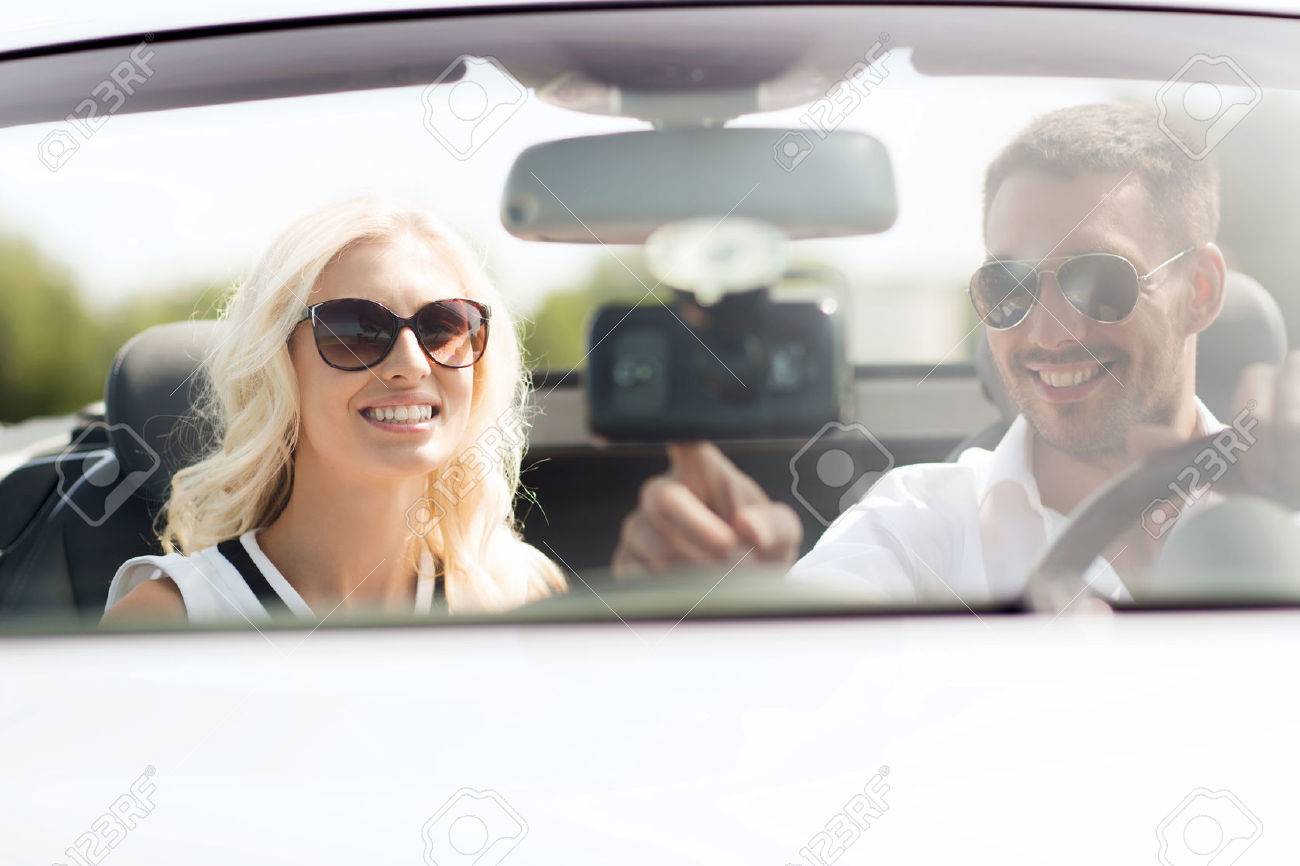 road trip, leisure, travel, technology and people concept - happy man and woman driving car and using gps navigation system - 50278148 road trip, leisure, travel, technology and people concept - happy man and woman driving car and using gps navigation system - 50278148
