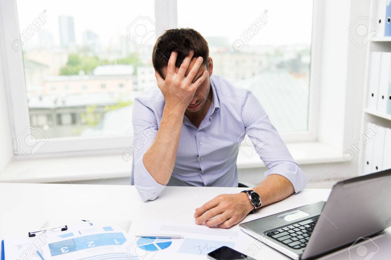 business, people, fail, paperwork and technology concept - businessman with laptop computer and papers working in office - 51023559 business, people, fail, paperwork and technology concept - businessman with laptop computer and papers working in office - 51023559