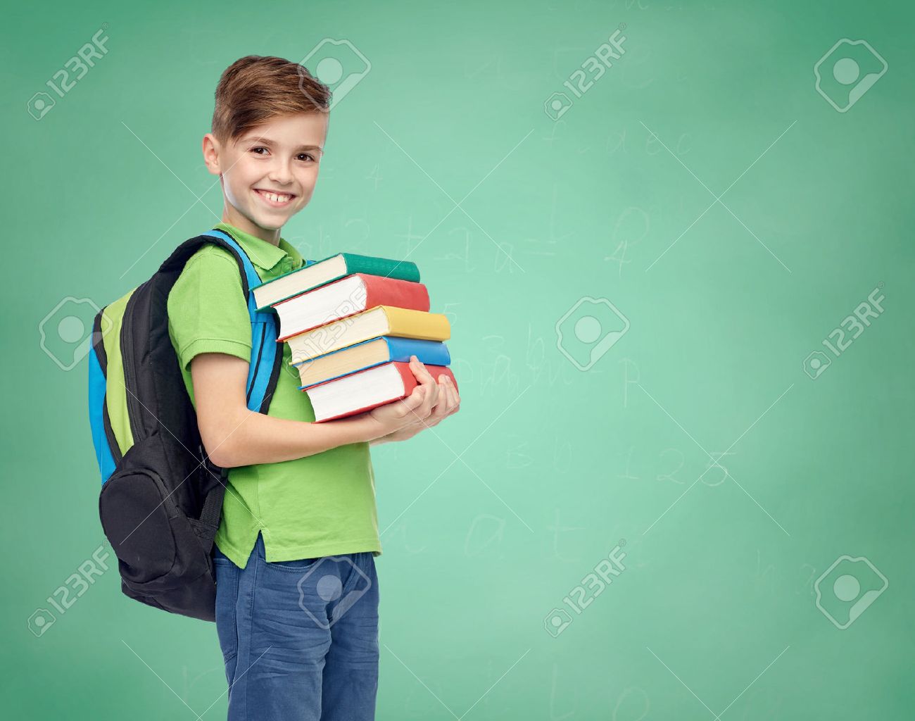 happy smiling student boy with school bag and books over green school chalk board background - 51808954 happy smiling student boy with school bag and books over green school chalk board background - 51808954