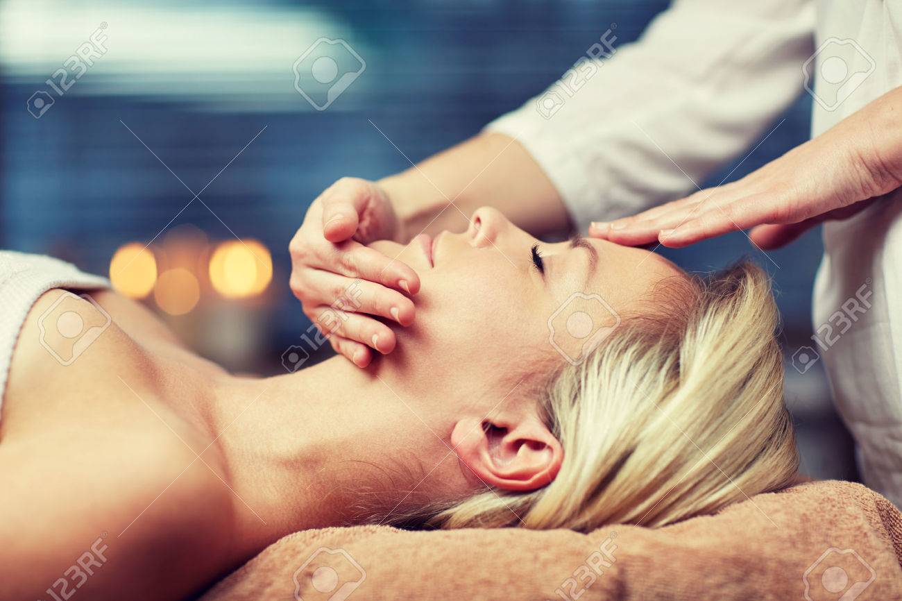 people, beauty, spa, healthy lifestyle and relaxation concept - close up of beautiful young woman lying with closed eyes and having face or head massage in spa - 52767449 people, beauty, spa, healthy lifestyle and relaxation concept - close up of beautiful young woman lying with closed eyes and having face or head massage in spa - 52767449
