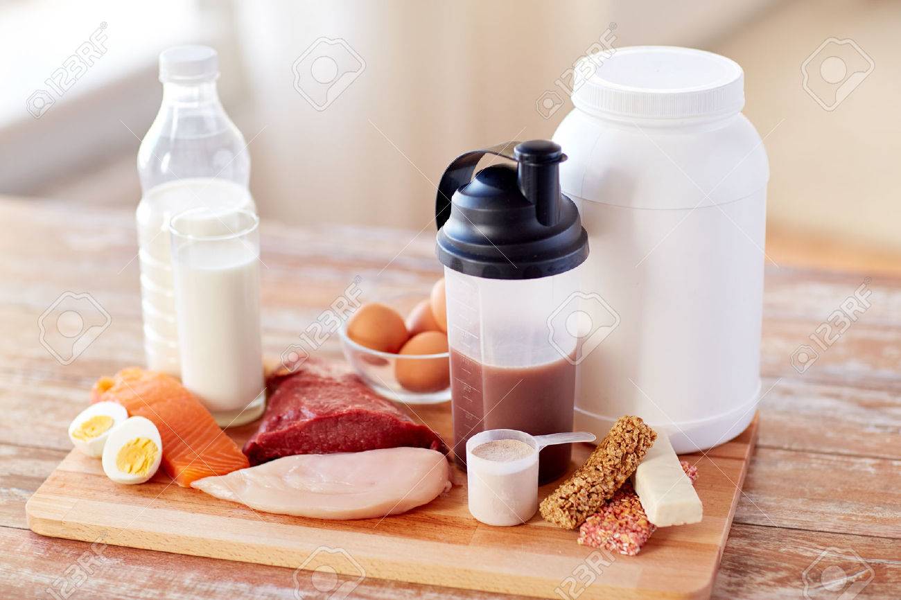 sport, fitness, healthy lifestyle, diet and people concept - close up of natural protein food and additive on wooden table - 54776184 sport, fitness, healthy lifestyle, diet and people concept - close up of natural protein food and additive on wooden table - 54776184